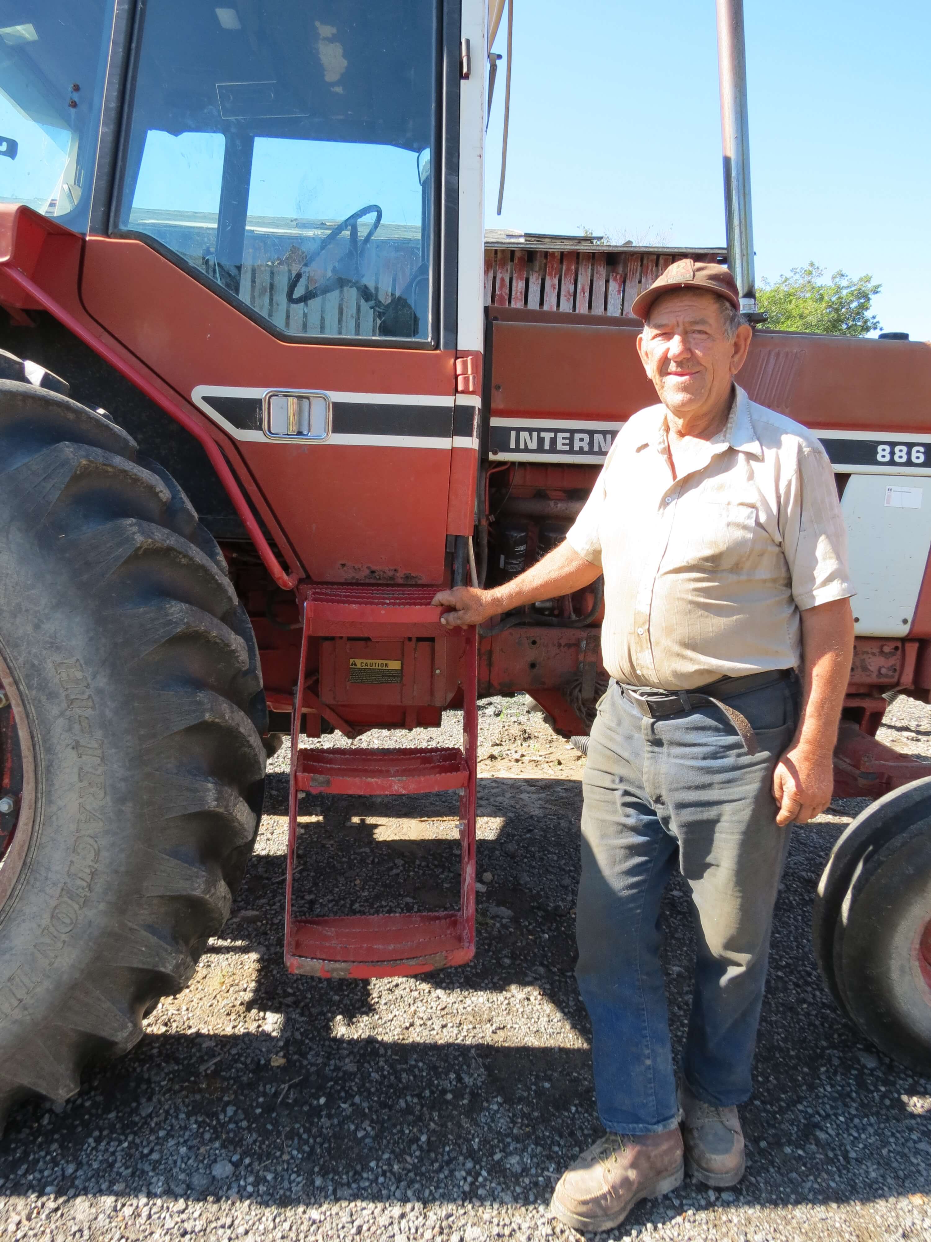 Old Farmer with New Case IH 886 Steps