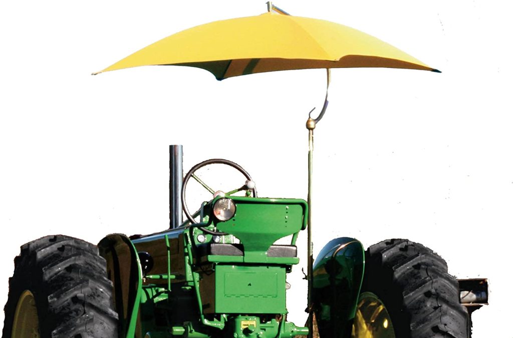 Tractor shade umbrella top attached to a tractor.