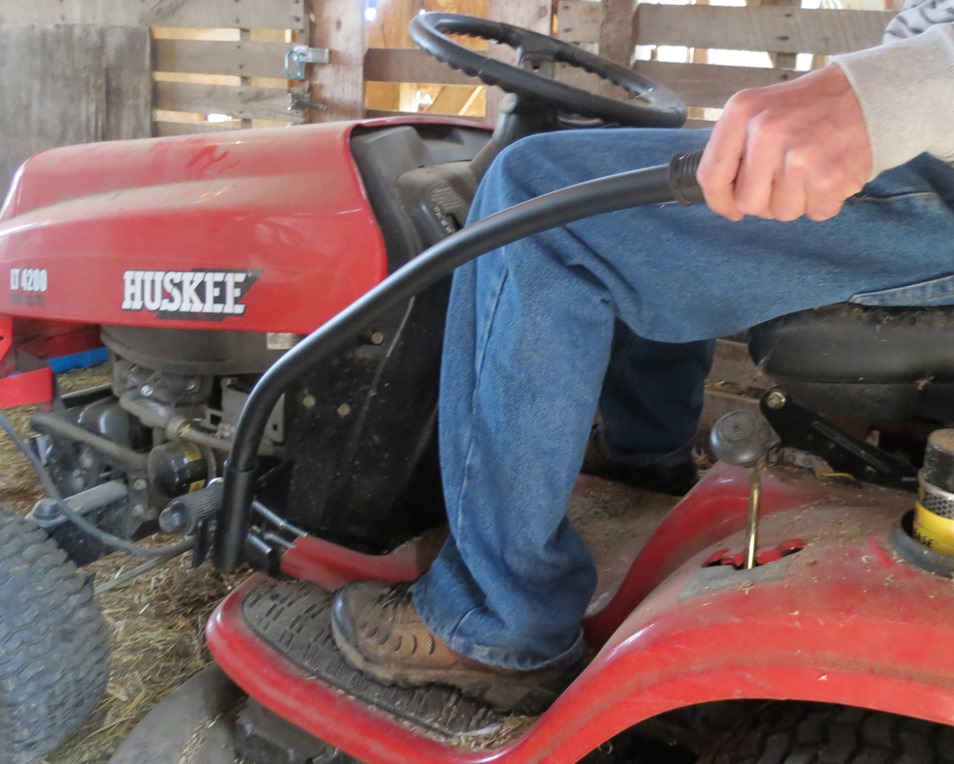 Lawnmower with hand lever on the foot pedal.