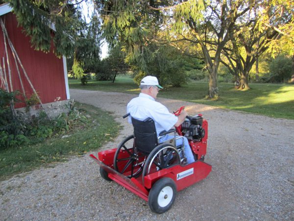 A guy in a wheelchair parked in the powerhouse while driving it forward.