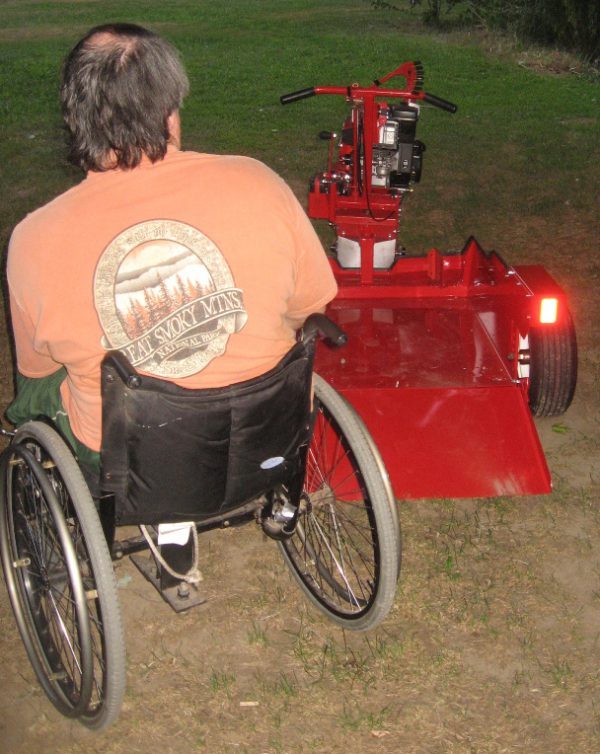 A person in a wheelchair parked by the powerhouse wheelchair driver.