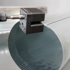 An impact power assisted crimper crimping the edge of an object.
