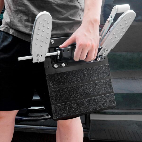 A person carrying the left foot accelerator pad in their left hand.