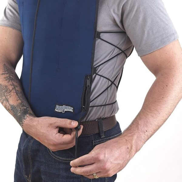 The same guy wearing the blue cooling vest is making sure the vest is fastened on correctly.