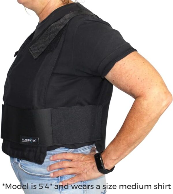 A person wearing an ice pack cooling vest showing from the side.