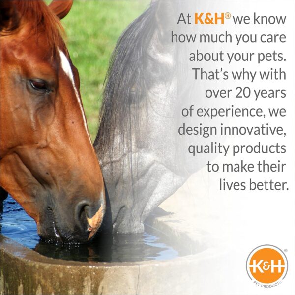 Two horses, one brown and one black, drinking out of a water hole that could be be heated with the heated water hose.