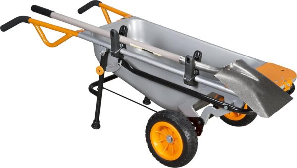 The wheelbarrow tool holders are clamped onto the wheelbarrow and then a shovel is placed in the holder section.